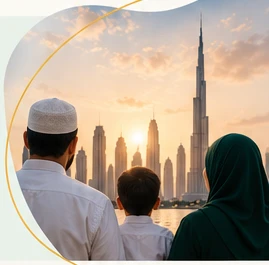 A father and son looking out over the Dubai skyline at sunset